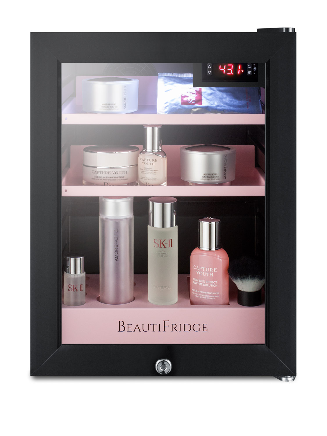 BeautiFridge compact cosmetics cooler with glass door, black cabinet, lock, matte blush pink shelves, and digital controls set for the storage of beauty products